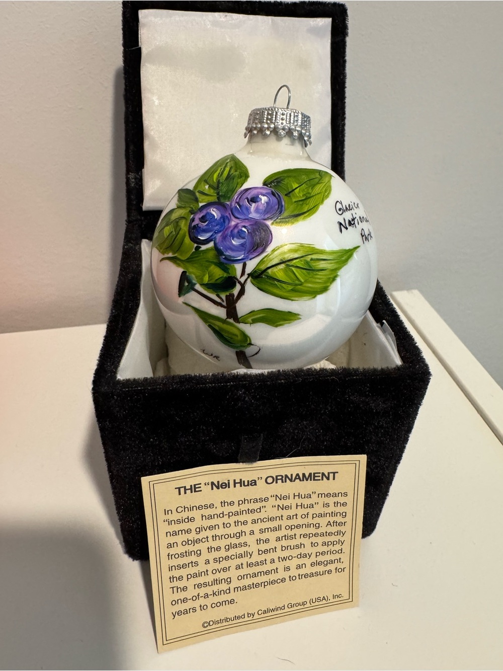 Glacier National Park Hand-Painted White Glass Ornament with Purple Design #401